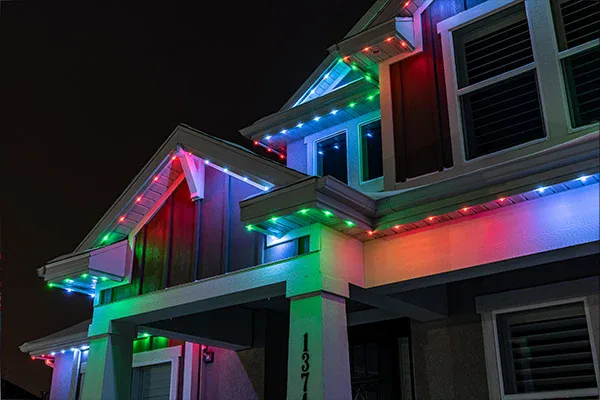 House with Permanent Outdoor LED Christmas Lights in red, green and white colors